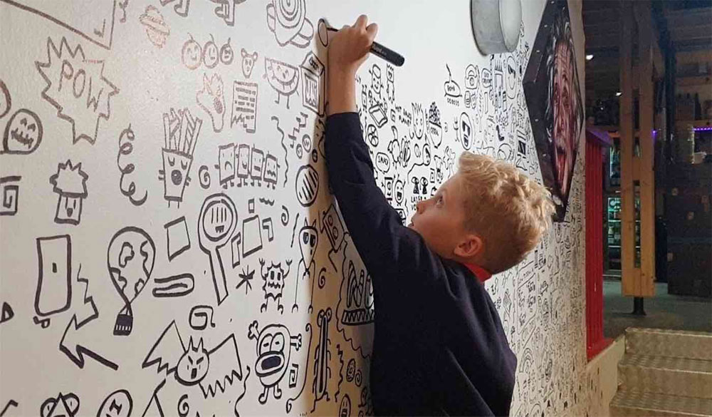 Kid In Trouble For Doodling Hired By Local Restaurant to Create Wall Art